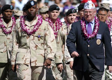 Active duty and retired Purple Heart recipients march onto the field prior to the kickoff of the 2005 NFL (National Football League) Pro Bowl, held in Honolulu, Hawaii (HI). The pre-game ceremony featured a salute for more than 60 Purple Heart recipients, a Hawaii Air National Guard fly over, and a coin toss by the US Pacific Command Commander