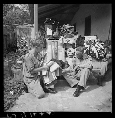 Major C W Brain and Gunner E J Shierlaw inspecting sports equipment, New Caledonia