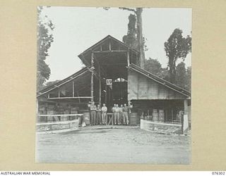 LAE, NEW GUINEA. 1944-09-27. PERSONNEL OF THE 43RD FIELD ORDNANCE DEPOT OUTSIDE ONE OF THE UNIT WORKSHOPS