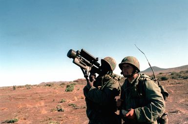 Two members of the 62nd Air Defense Artillery, 25th Infantry Division, track and fire upon a Ballistic Aerial Target (BAT) using a Redeye missile weapon system during a live fire training exercise at the Pohakuloa Training Area