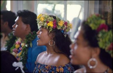 Three people singing