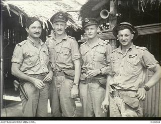 MILNE BAY, PAPUA. 1943-07-22. BEAUFORT CREW OF NO. 100 SQUADRON RAAF, IMMEDIATELY AFTER RETURN FROM A STRIKE ON GASMATA. LEFT TO RIGHT: FLYING OFFICER (FO) D. WILSON-ROBERTS, MURRAY BRIDGE, SA; ..