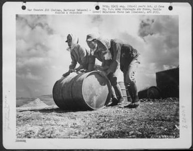 Japanese Soliders And Civilian Prisoners Of War Rolling And Stacking Gasoline Drums At A Supply Dump On Saipan, Marianas Islands. 29 June 1944. (U.S. Air Force Number A63576AC)