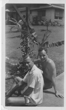 Roenigk and Hudson sitting on ground