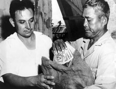 [E.T. Calvo and Felix Tajalle Exchanging Currencies]
