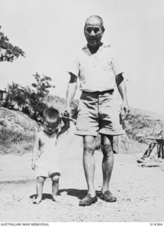 1943-03-02. NEW GUINEA. PORT MORESBY. A GROUP OF CHINESE WHOSE AGES RANGE FROM 10 MONTHS TO 70 YEARS WALKED 500 MILES FROM WEWAK AN HOUR AFTER A JAPANESE CONVOY WAS SIGHTED. PICTURE SHOWS 61 YEAR ..
