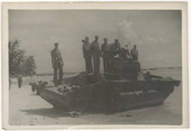 [Servicemen on Japanese tank]