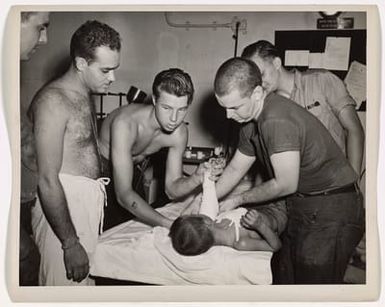 Photograph of Injured Japanese Child Receiving Medical Attention