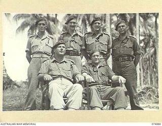 MILILAT, NEW GUINEA. 1944-07-22. OFFICERS OF HEADQUARTERS, ROYAL AUSTRALIAN ARTILLERY 5TH DIVISION. IDENTIFIED PERSONNEL ARE:- NX133368 LIEUTENANT R.R. BROAD, AMENITIES (1); NX102720 LIEUTENANT ..