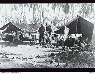 MADANG, NEW GUINEA. 1944-06-15. THE QUARTERMASTERS' STORE AT HEADQUARTERS, 15TH INFANTRY BRIGADE. THE UNIT IS AT PRESENT LOCATED AT SIAR PLANTATION. LEFT TO RIGHT: VX104828 WARRANT OFFICER 1 E. G. ..