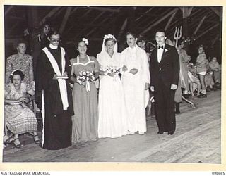 LAE, NEW GUINEA. 1945-11-08. THE BRIDAL GROUP, WHO WERE THIRD PRIZE WINNERS IN THE BEST GROUP, AT THE FANCY DRESS PARTY HELD BY MEMBERS OF BARRACKS TO FAREWELL CAPTAIN M.W. HORNSBY AND CAPTAIN ..