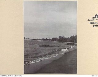 SANANANDA, NEW GUINEA, 1945-07-03 TO 1945-07-04. A WRECKED JAPANESE LANDING CRAFT ON SANANANDA BEACH