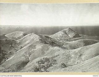 PORT MORESBY, PAPUA. 1942-08. LOOKING FROM MAATA (POST "C") OUT ACROSS RUGGED HILLS TO THE ENTRANCE TO BOOTLESS INLET