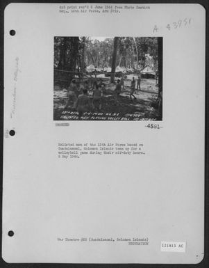 Enlisted Men Of The 13Th Air Force Based On Guadalcanal, Solomon Islands Team Up For A Volleyball Game During Their Off-Duty Hours. 5 May 1944. (U.S. Air Force Number 121813AC)