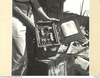 LAE, NEW GUINEA. 1944-09-27. A SMALL PORTABLE SIX VOLT BATTERY AT THE 43RD FIELD ORDNANCE DEPOT