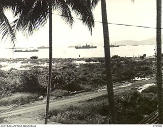 MILNE BAY, PAPUA, NEW GUINEA. 1944-04-03. VIEWING THE CONCENTRATION OF SHIPPING IN THE HARBOUR. THE PIPELINE IN THE FOREGROUND CARRIES FUEL DIRECTLY FROM TANKERS TO BULK OIL INSTALLATIONS AT THE ..