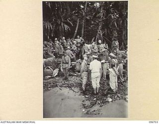 KAIRIRU ISLAND, NEW GUINEA. 1945-09-17. A CONFERENCE BETWEEN JAPANESE NAVAL OFFICERS AND AUSTRALIAN STAFF OFFICERS ON THE BEACH IN VICTORIA BAY. FOLLOWING THE SURRENDER ALL JAPANESE NAVAL PERSONNEL ..