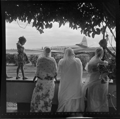 Locals watching Fiji Airways aeroplane, VQ-FAY, at Nadi Airport, Fiji