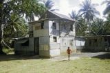 Federated States of Micronesia, boy playing outside home in Chuuk State