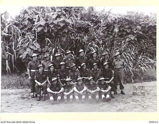 Group portrait of the personnel of 146 Supply Depot Platoon, 30 Advanced Supply Depot. Left to right, back row: NX193783 Private (Pte) V Stapleton of Concord, NSW; QX44962 Pte C R Douglas of ..