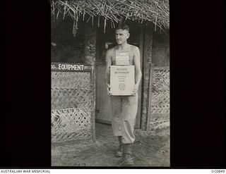 KIRIWINA, TROBIAND ISLANDS, PAPUA. C. 1944-03. 116280 LEADING AIRCRAFTMAN K. G. YATES OF GLENELG, SA, WITH NO. 30 (BEAUFIGHTER) SQUADRON RAAF, HAS NOT CARRIED EGGS FOR A LONG TIME BUT HE HANDLES ..