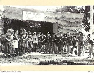 SIAR, NEW GUINEA. 1944-06-25. A DISPLAY OF THE COSTUMES WORN BY MEMBERS OF THE CAST OF THE 57/60TH INFANTRY BATTALION CONCERT PARTY DURING THE CONCERT STAGED AT THE UNIT THEATRE