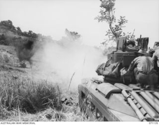 GUSIKA, NEW GUINEA. 1944-03-15. A MATILDA TANK FROM THE 1ST TANK BATTALION, FIRING A 3" HOWITZER HIGH EXPLOSIVE 119 TO TEST THE VULNERIBILITY OF A CUPOLA FITTED TO THE BODY OF ANOTHER MATILDA TANK. ..