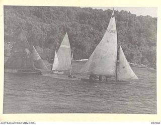 JACQUINOT BAY, NEW BRITAIN. 1945-06-10. YACHTS OF THE ROYAL PACIFIC YACHT CLUB, A CLUB FORMED BY MEN AND OFFICERS IN HEADQUARTERS 5 DIVISION AREA, WHO HAVE BUILT THEIR OWN CRAFT FROM ODDS AND ENDS. ..