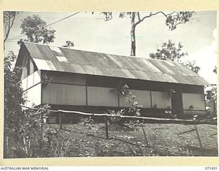 KOITAKI, PORT MORESBY AREA, PAPUA, NEW GUINEA. 1944-03-27. THE MUSIC HUT OF THE AUSTRALIAN ARMY EDUCATION SERVICE ATTACHED TO THE 113TH CONVALESCENT DEPOT VIEWED FROM THE GARDEN