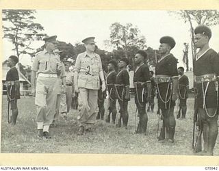 LAE, NEW GUINEA. 1945-03-27. LORD WAKEHURST, KCMG, GOVERNOR OF NEW SOUTH WALES (2), ACCOMPANIED BY N445244 CAPTAIN A.M. SINCLAIR, OFFICER COMMANDING POLICE TRAINING DEPOT, ROYAL PAPUAN CONSTABULARY ..