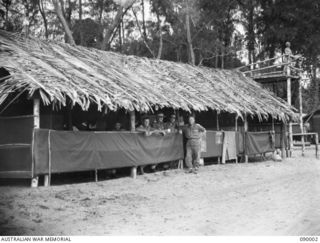 TOKO, BOUGAINVILLE. 1945-03-28. MAJOR F.G.B. PULLEN, 3 DIVISION (1), WITH HEADQUARTERS 7 INFANTRY BRIGADE PERSONNEL AT THE TOKO COMMAND AREA, WHERE ALL STORES AND TROOPS OPERATING IN THE SOUTH ..