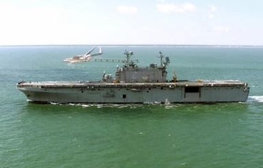 Port side view of the US Navy (USN) TARAWA CLASS: Amphibious Assault Ship USS SAIPAN (LHA 2) underway off the coast of Virginia Beach, Virginia (VA)
