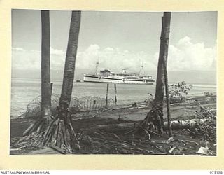 LAE, NEW GUINEA. 1944-08-14. THE 2/1ST HOSPITAL SHIP MANUNDA AT ANCHOR IN THE HARBOUR. THE VESSEL BROUGHT MEMBERS OF THE AUSTRALIAN ARMY NURSING SERVICE FROM THE 128TH GENERAL HOSPITAL (128AGH), ..