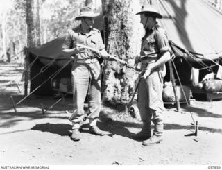 WONDECLA, QLD. 1943-10-07. QX29772 PRIVATE R. C. WADDINGTON (LEFT) AND NX107959 CORPORAL (CPL) F. D. MCNALLY, BOTH OF "B" COMPANY, 2/5TH AUSTRALIAN INFANTRY BATTALION, 17TH AUSTRALIAN INFANTRY ..