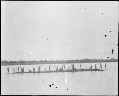 Twenty six standing paddlers, Ramu River, New Guinea, 1935, 2 / Sarah Chinnery