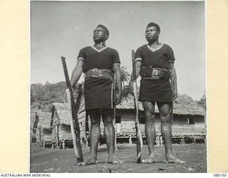 KAKAKOG, NEW GUINEA. 1944-06-27. MEMBERS OF THE ROYAL PAPUAN CONSTABULARY OUTSIDE THEIR QUARTERS