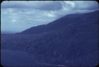 The forbidding coastline beyond Kalo Kalo : Kalo Kalo Methodist Mission Station, D'Entrecasteaux Islands, Papua New Guinea 1956-1958 / Terence and Margaret Spencer