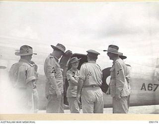 JACQUINOT AIRSTRIP, NEW BRITAIN. 1945-03-29. LADY BLAMEY (3), STEPPING FROM THE PLANE DURING HER OFFICIAL VISIT WITH LORD WAKEHURST, GOVERNOR OF NEW SOUTH WALES (2), AND LADY WAKEHURST TO ..