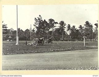 LAE, NEW GUINEA. 1944-03-24. ADMINISTRATION BUILDINGS VIEWED FROM THE ENTRANCE TO HEADQUARTERS LAE BASE SUB-AREA. (JOINS WITH PHOTOGRAPHS NUMBERED 071666 TO 071672 SHOWING THREE CAPTURED JAPANESE ..