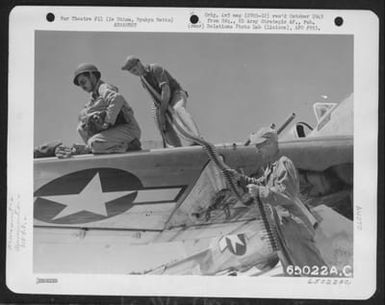 Armorers Removing Ammunition From Wing Guns Of A Republic P-47 'Thunderbolt' Of The 318Th Fighter Group Upon Completion Of Long Flight From Saipan, Marianas Islands, To Ie Shima, Ryukyu Retto. (U.S. Air Force Number 65022AC)