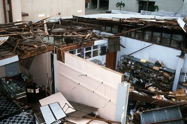 A demolished building displays the effects of Typhoon Omar which struck on August 29th, causing severe damage to Andersen Air Force Base; Naval Station, Guam; and the surrounding area