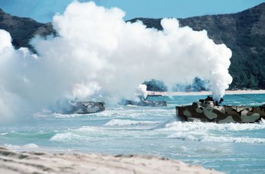 AAVP7A1 assault amphibian vehicles come ashore amidst a smokescreen during the amphibious assault phase of Exercise RIMPAC 88