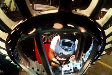 A member of the 43rd Bombardment Wing Corrosion Control Branch works on an aircraft component