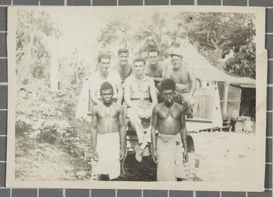 Group of American sailors and Papua New Guineans outside a tent, Nissan