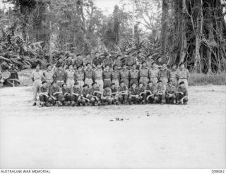 Group portrait of personnel of the Headquarters Administrative Squadron, 2/4th Armoured Regiment. Left to right, back row: SX23738 Trooper (Tpr) H V Sims of Coolangatta, Qld; VX74616 Tpr E J ..