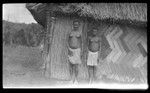 Two young women near a house