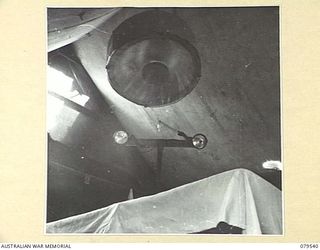 ORO BAY, NEW GUINEA. 1943-07. AN IMPROVISED SHADOWLESS LAMP IN THE OPERATING THEATRE OF THE 10TH FIELD AMBULANCE. THE REFLECTING SURFACES WERE MADE OF STRIPS OF ALUMINIUM FROM A FIELD FRACTURE ..