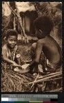 Young boys preparing food in a bowl, New Caledonia, ca.1900-1930