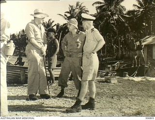 NEW GEORGIA, SOLOMON ISLANDS. 1943-03. CAPTAIN D.G. KENNEDY, BRITISH SOLOMON ISLANDS PROTECTORATE DEFENCE FORCE, AND LIEUTENANT A.R. EVANS, ROYAL AUSTRALIAN NAVY VOLUNTEER RESERVE, BOTH ..