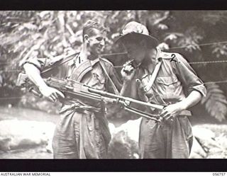 SALAMAUA AREA, NEW GUINEA. 1943-07-22. VX36052 PRIVATE J. R. PRIGG (LEFT) AND WX14029 PRIVATE D. SMITH (RIGHT) MACHINE GUNNERS OF "A" COMPANY, 2/5TH BATTALION